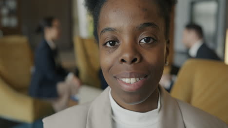 businesswoman smiling in an office setting