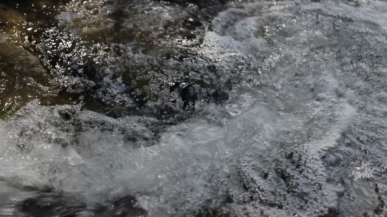 Following flow of water down stream.
