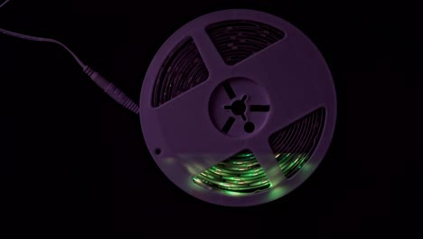 beautiful colorful led lightning circles against black background with lightning effects.