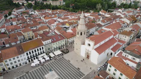 aerial view of historic town square with grand church and traditional buildings