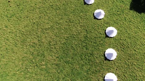 Aerial-footage-of-canvas-Bell-Tents,-bird-eye-view