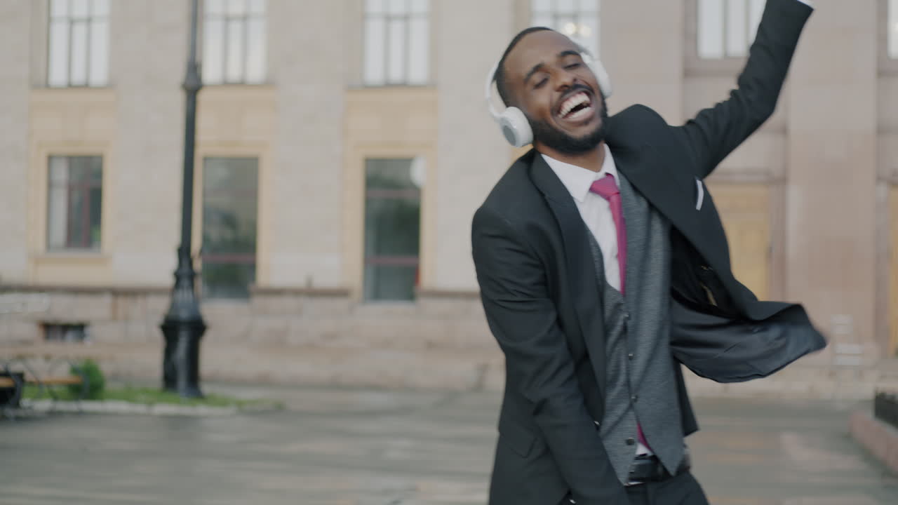 Happy Businessman Dancing in the City