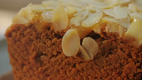 fresh cake with almonds in bakery shop close-up. artisan sweets and bread is making by skill bakers using natural and high-quality ingredients. food with health and flavour benefits. sweet breads for dessert and breakfast. bakery shop and market