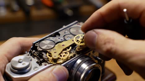 an intricate exploration of camera mechanics: a close-up on the craftsmanship behind the gears and components of a vintage camera