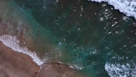 Bird's-Eye-View-Of-Tourists-Swimming-At-Crystal-Bay-Beach-In-Nusa-Penida-Near-Bali,-Indonesia