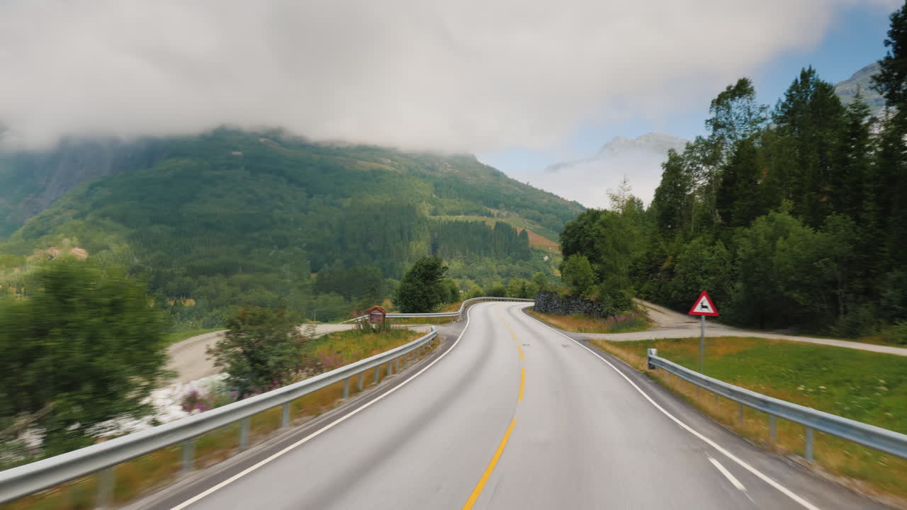Premium stock video Drive along the handsome road among the mountains