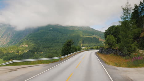 Drive-Along-The-Handsome-Road-Among-The-Mountains-Of-Norway-Pov-View-From-The-Bus-Window