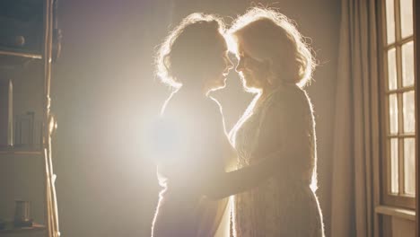 backlit elderly couple embracing tenderly in warm light, creating a romantic and intimate atmosphere in a series of variations with different light and color grading