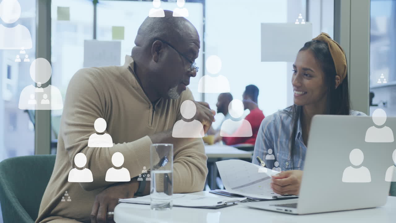 Animation of icons over diverse business people
