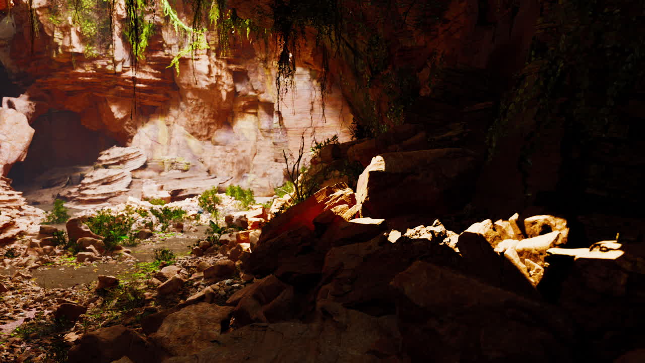 A view inside a dark and deep cave with light shining in from above