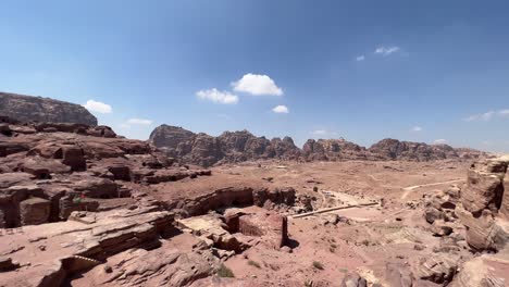 epic view of the petra valley in wadi musa, jordan with the treasury in the middle of a rocky and mountainous landscape, an unesco heritage site, ancient nabatean kingdom 4k establish shot