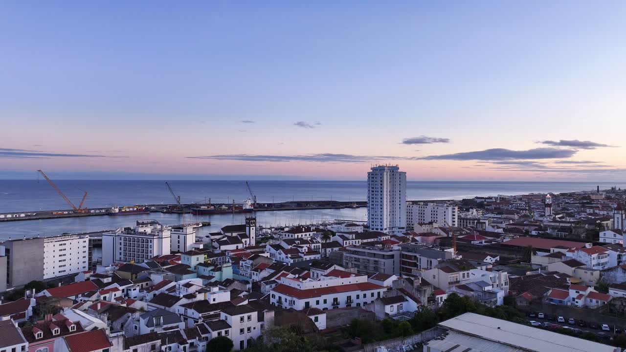 Aerial View of a Coastal City at Sunset