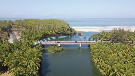 aerial view of soge bridge, the bridge located in pacitan district has a beautiful view of the beach and a large river surrounded by hills