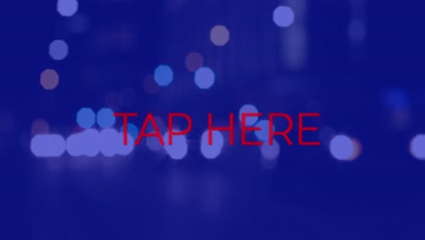 Animation-of-tap-here-text-over-cityscape-at-night-on-blue-background