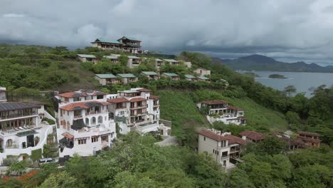 aerial-drone-shot-tropical-beach-and-hill-settlements