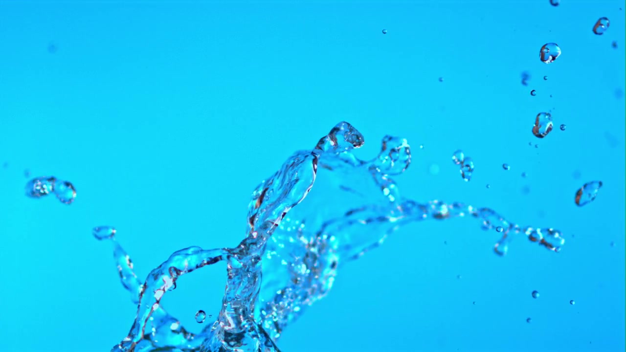 Slow Motion Water Splash on Vibrant Blue Background