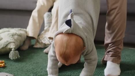 mom playing with toddler boy at home