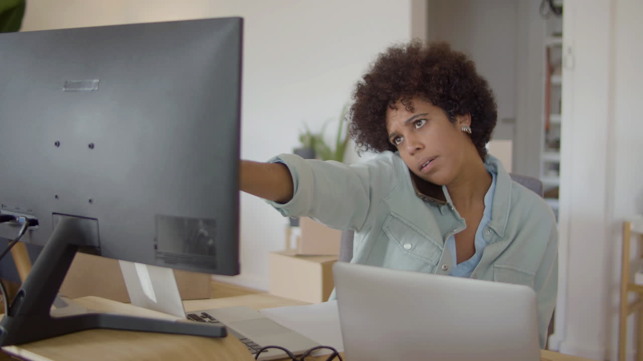 Young startup owner talking to customer on phone