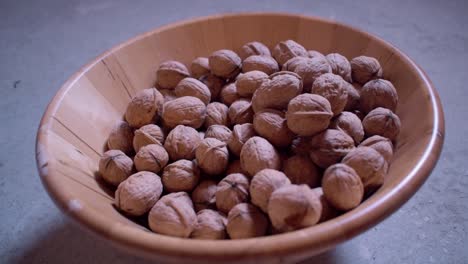 Dried walnuts in a wooden bowl-14