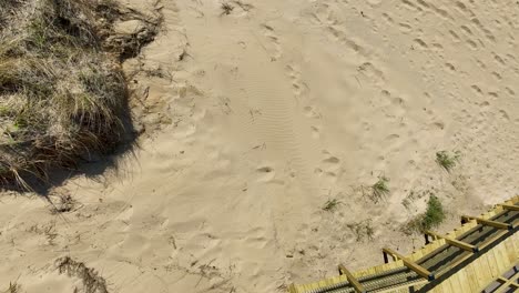 direct aerial showing the sand, dunes, and stair access point