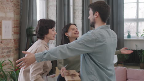 people exchanging gifts indoors