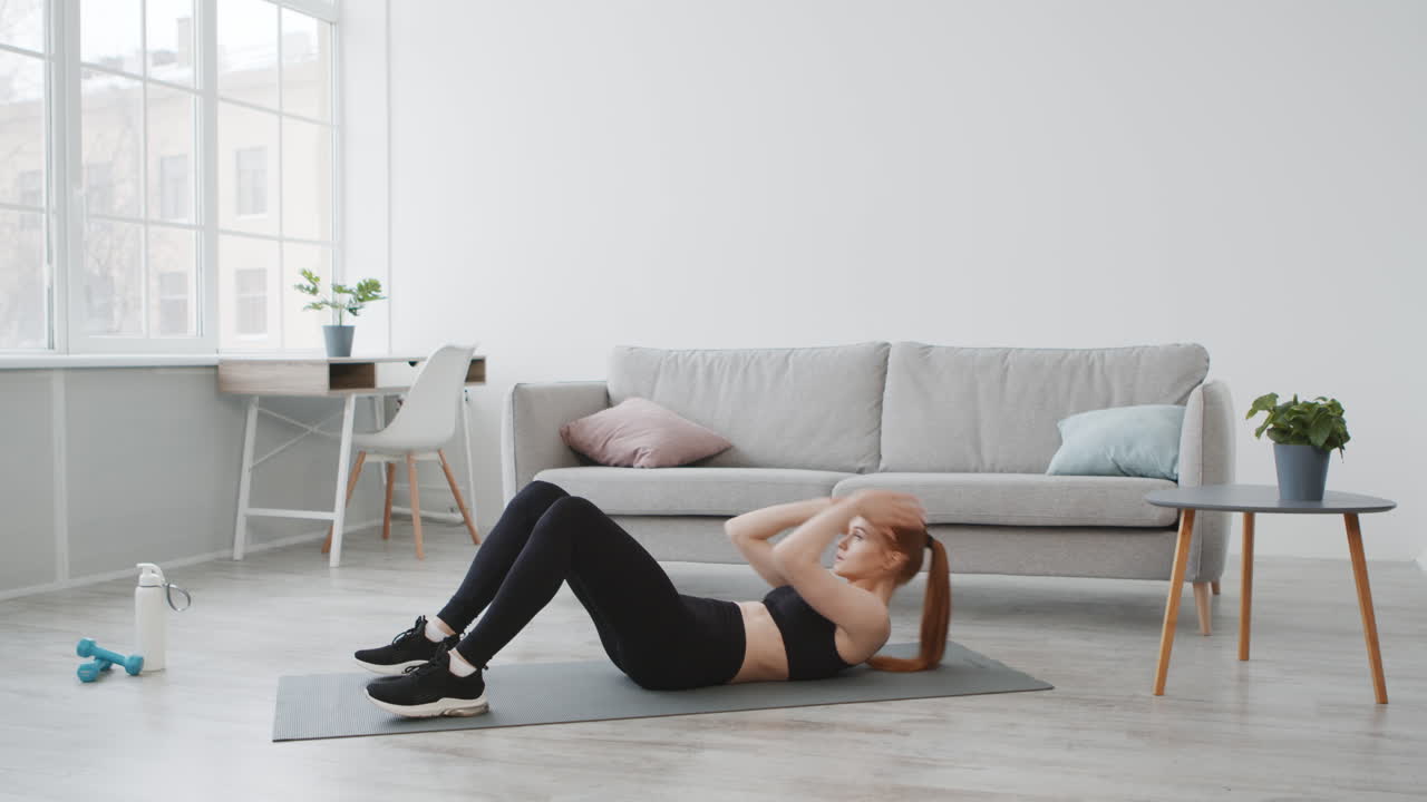 Woman Doing Sit-Ups at Home