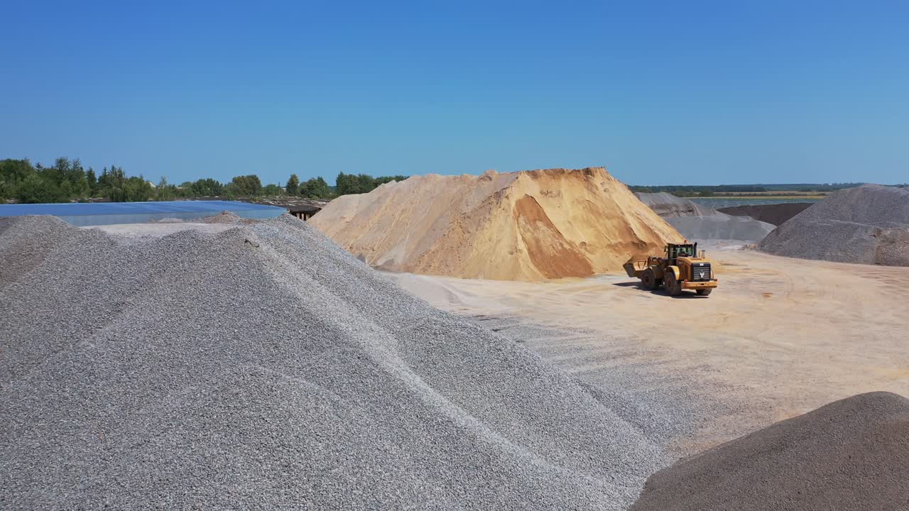 Road construction from above. Aerial view of process with heavy equipment on the construction site