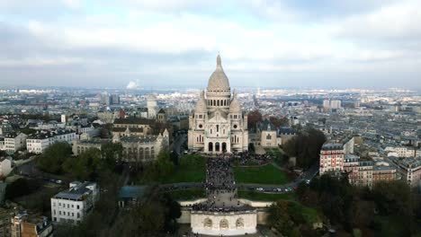 Aerial-approach-of-Basilica-of-Sacré-Coeur-or-Sacred-Heart-of-Montmartre-in-Paris,-France