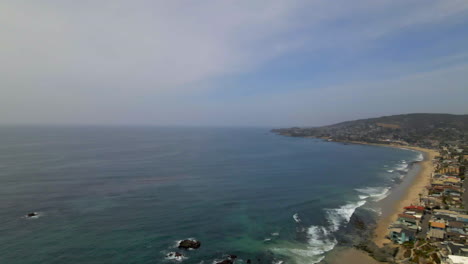 aerial view of coastal town, beach, and ocean