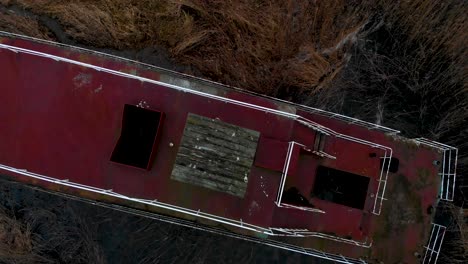 abandoned shipwreck on the grassy shore of dabie lake in poland