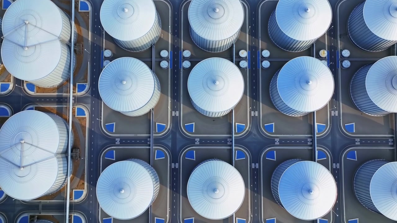Aerial Storage Tank Farm Pattern Showcasing Rows Of White Cylindrical Tanks With Conical Roofs, Connecting