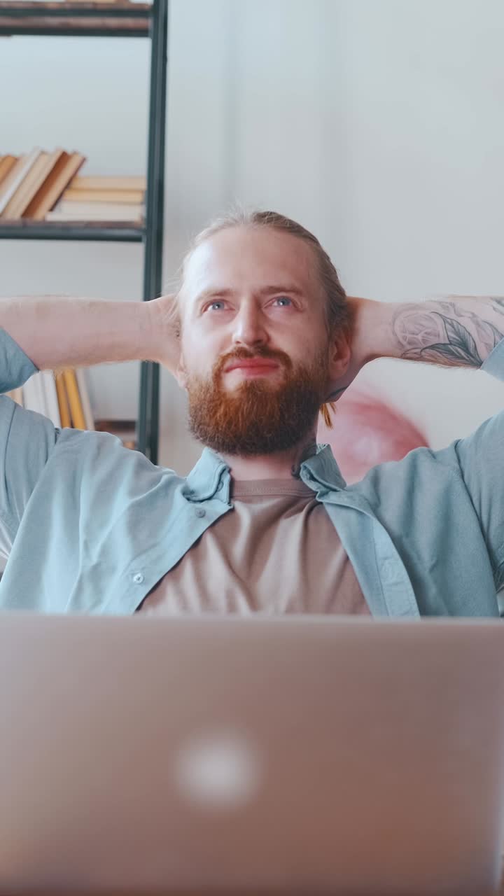 Young man focuses on work at home office during daytime