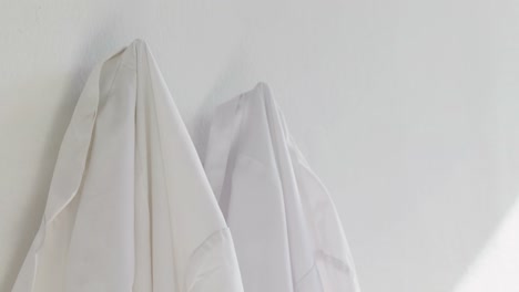 Shirts-hanging-on-wall-4k