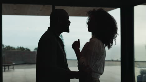 couple embracing indoors