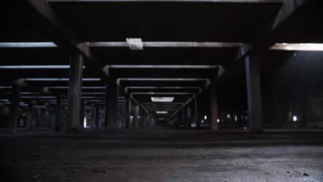 empty abandoned building skeleton, concrete pillars and pools of water