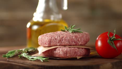 the raw burger on the cutting board slowly rotates.