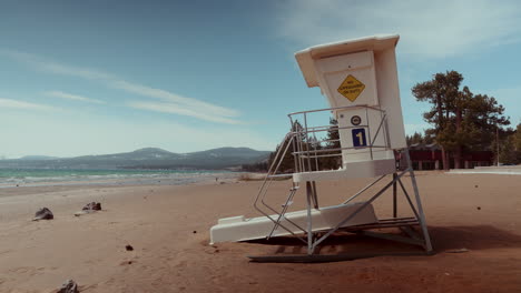 empty beach scene with lifeguard stand