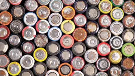 many used batteries rotate on a turntable around its axis movement many used batteries rotate on a turntable around its axis