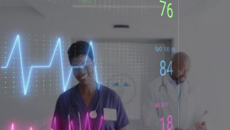 Animation-of-cardiograph-over-diverse-doctors-working-at-hospital