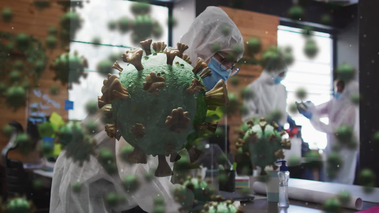 소독제를 사용하여 사무실을 청소하는 의료 종사자 그룹 위에 떠다니는 다수의 코로나19 세포