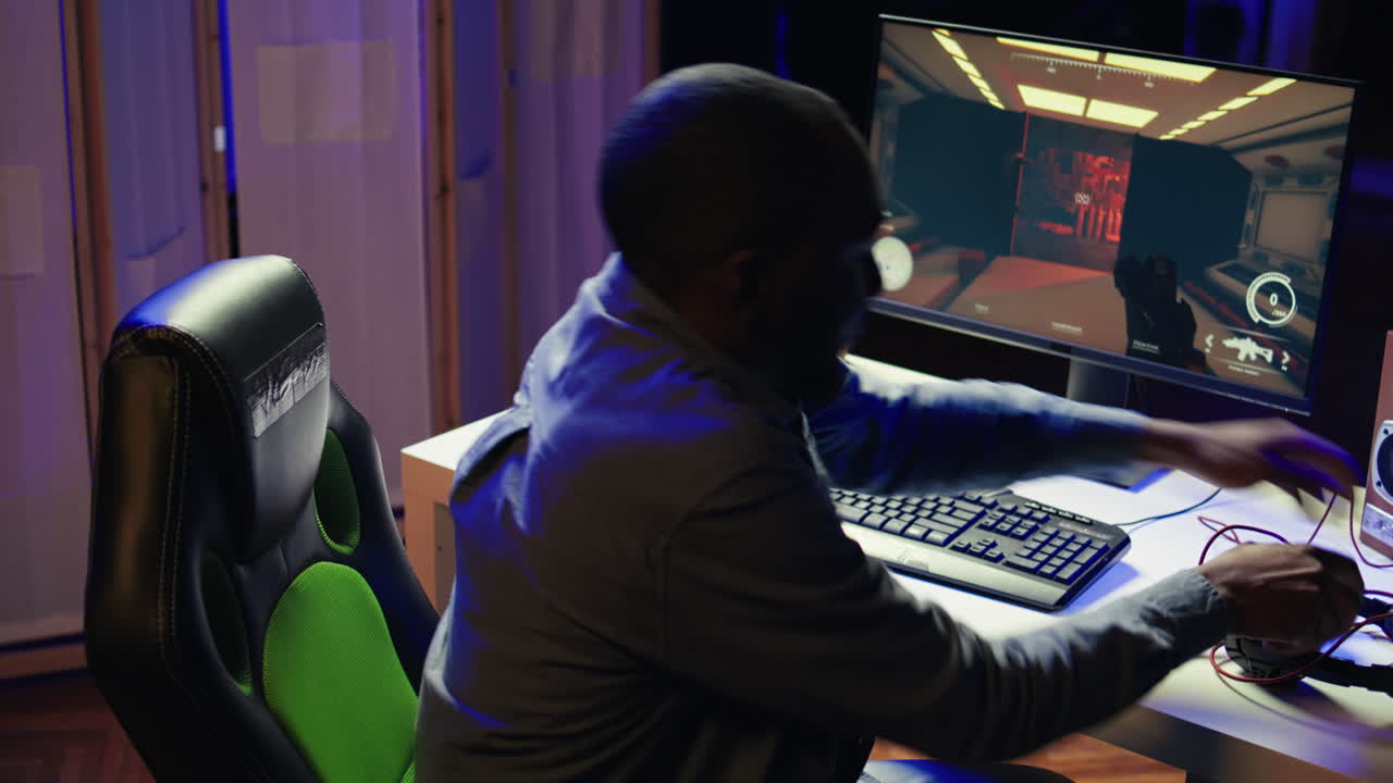 Streamer playing on PC, using headphones to talk with audience