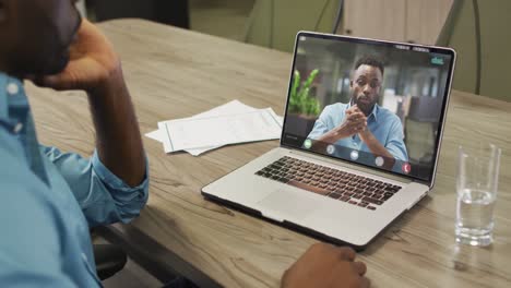 African-american-businessman-using-laptop-for-video-call-with-african-american-business-colleague