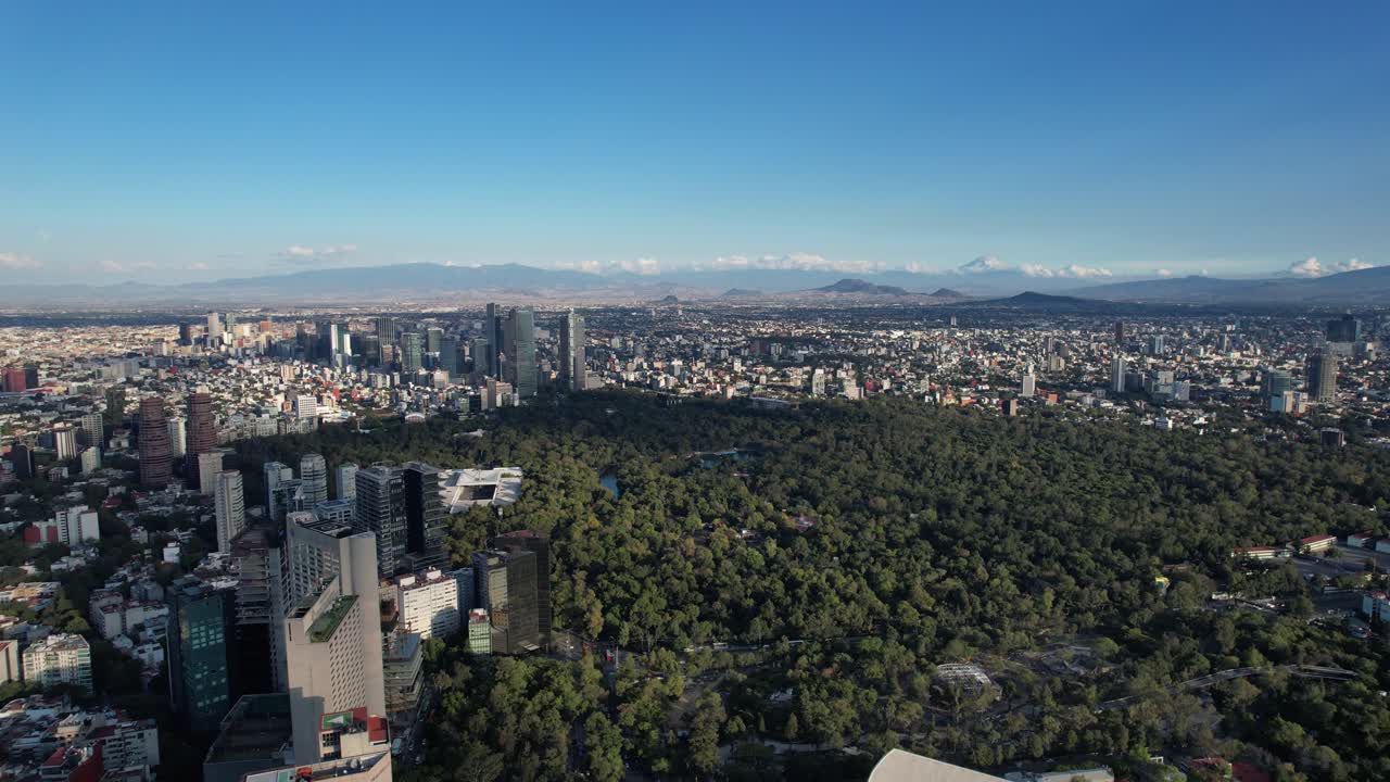 Backwards drone shot of chapultepec forest in mexico city