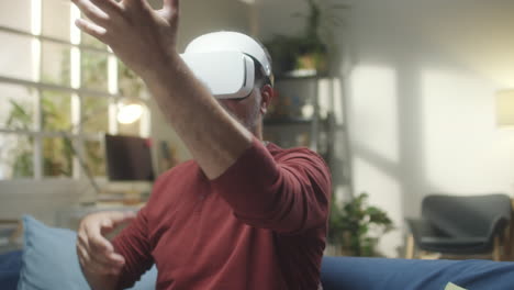 man experiencing virtual reality with a vr headset at home