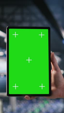 vertical video close up of data center employee doing tasks on isolated screen tablet