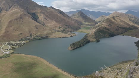 Wide-view-of-a-lake-in-between-mountains-at-Moke-Lake,-Queenstown,-New-Zealand