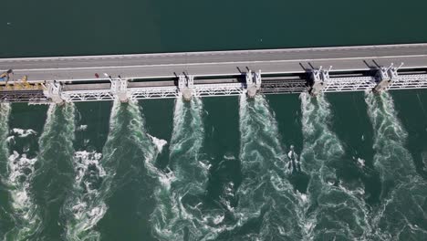 the eastern scheldt storm surge barrier that protects the coast of the netherlands from the incoming tides on a sunny day