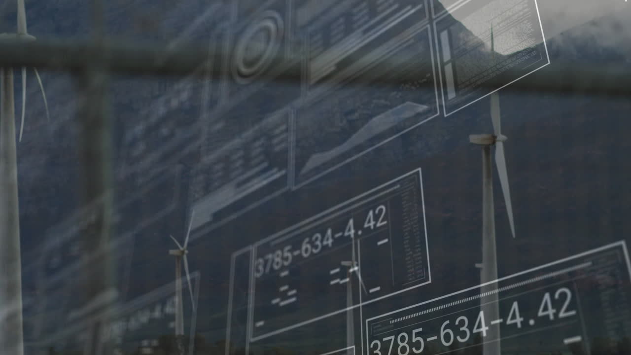 Tall wind turbine rotating on right, presenting holographic data panels over mountain landscape