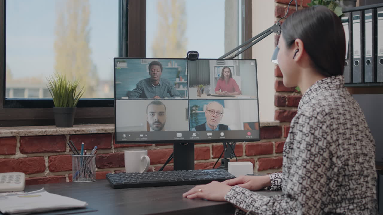 Business woman talking to colleagues on online video call