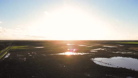 sunset over dutch marsh landscape